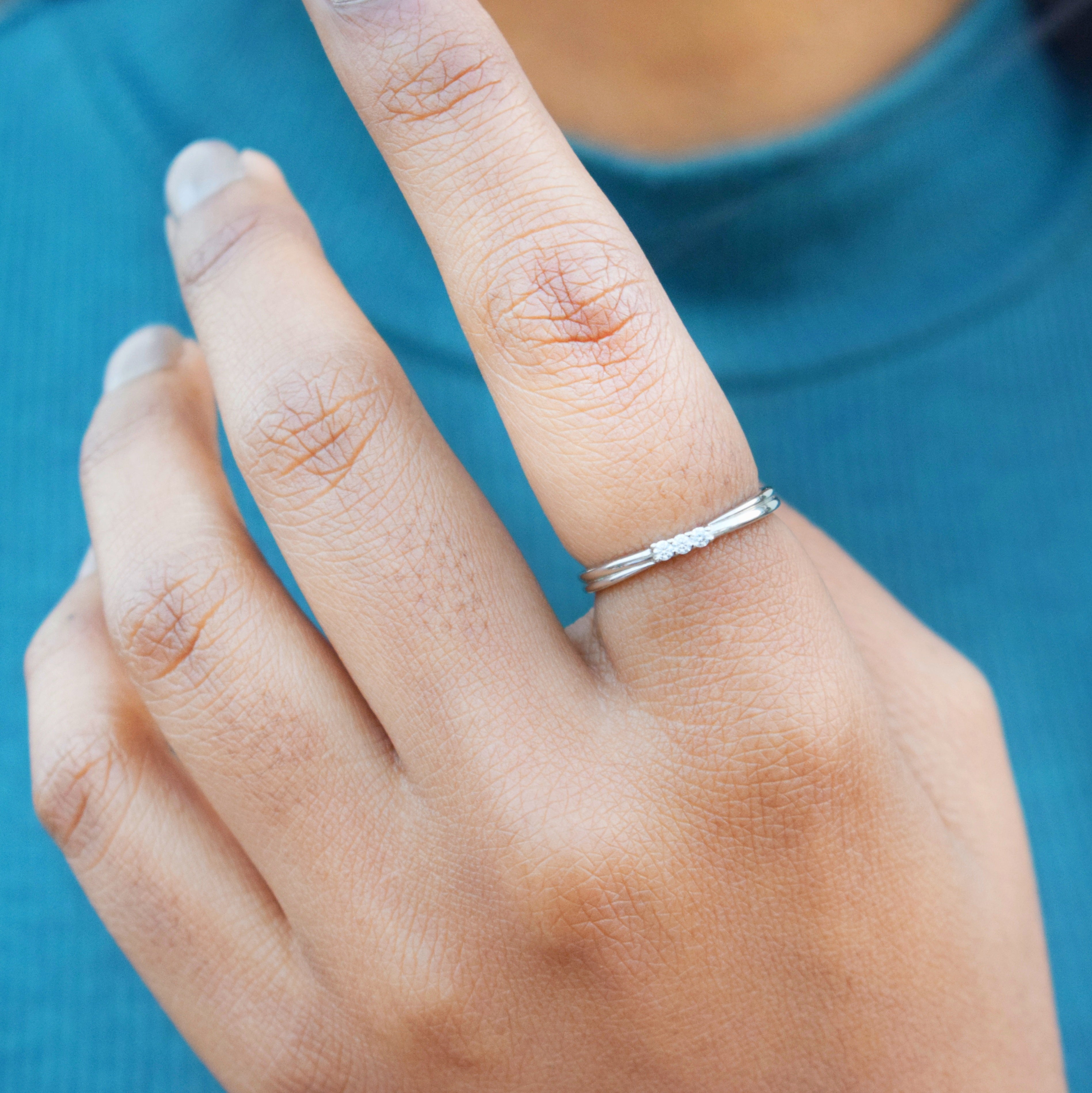 Minimal 3 stone Moissanite Ring