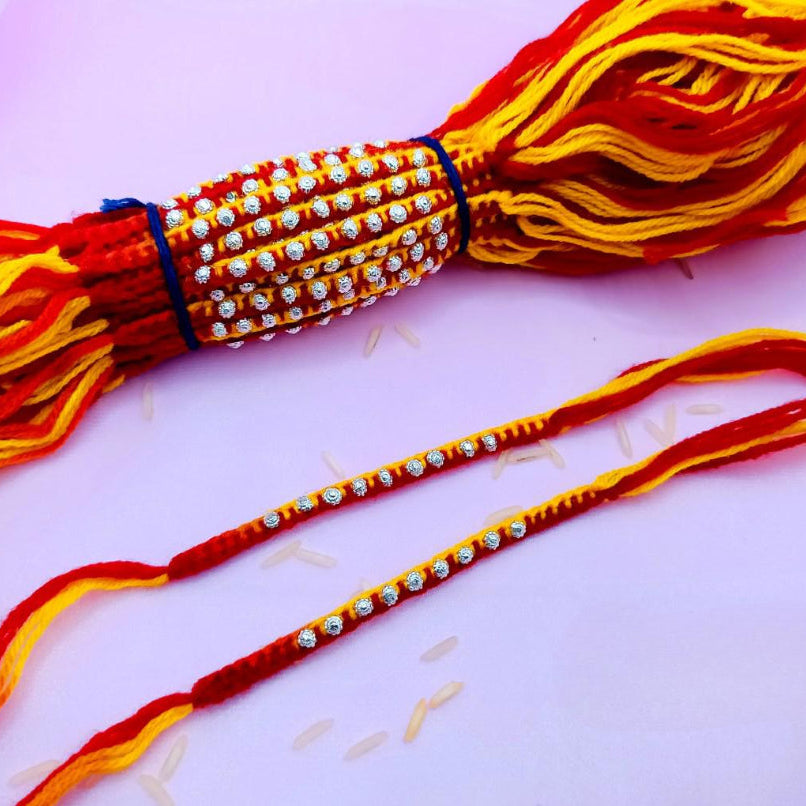 9 Flower with Red & Yellow wool Thread Silver Rakhi