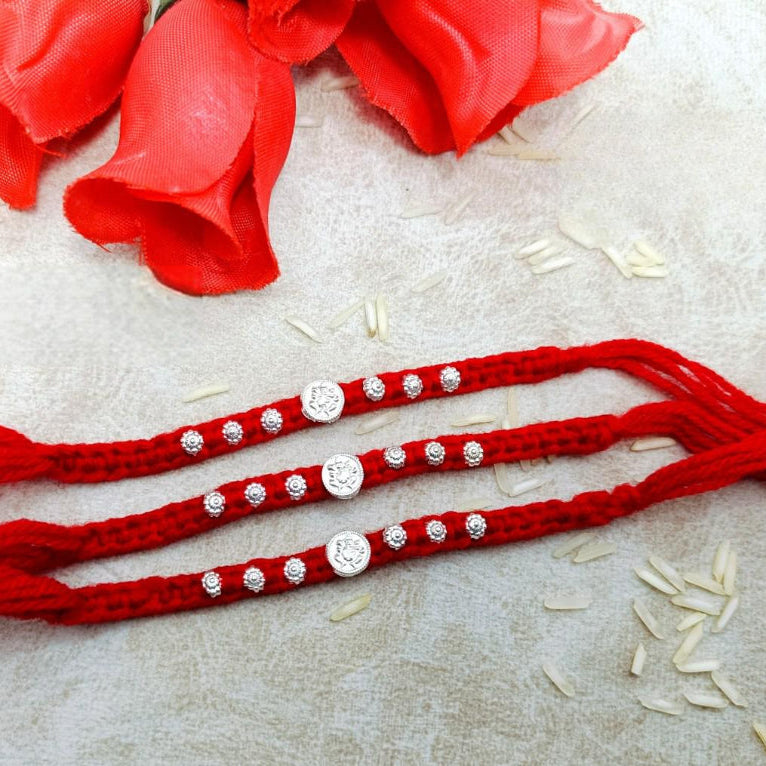 Ganeshji Ginni with 6 Flower in wool Thread Silver Rakhi