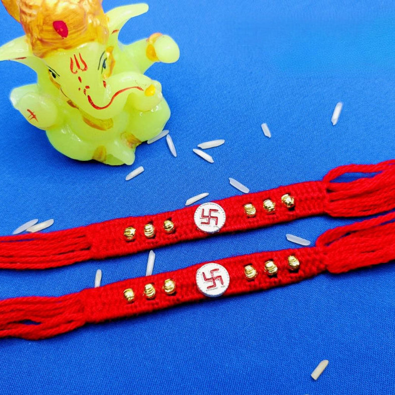 Swastik Ginni with 6 Flower in Red & Yellow wool Thread Silver Rakhi