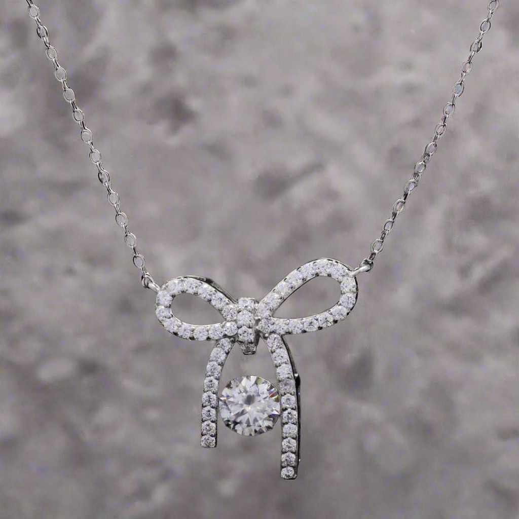 Sterling Silver Elegant Bow Pendant with Moissanite