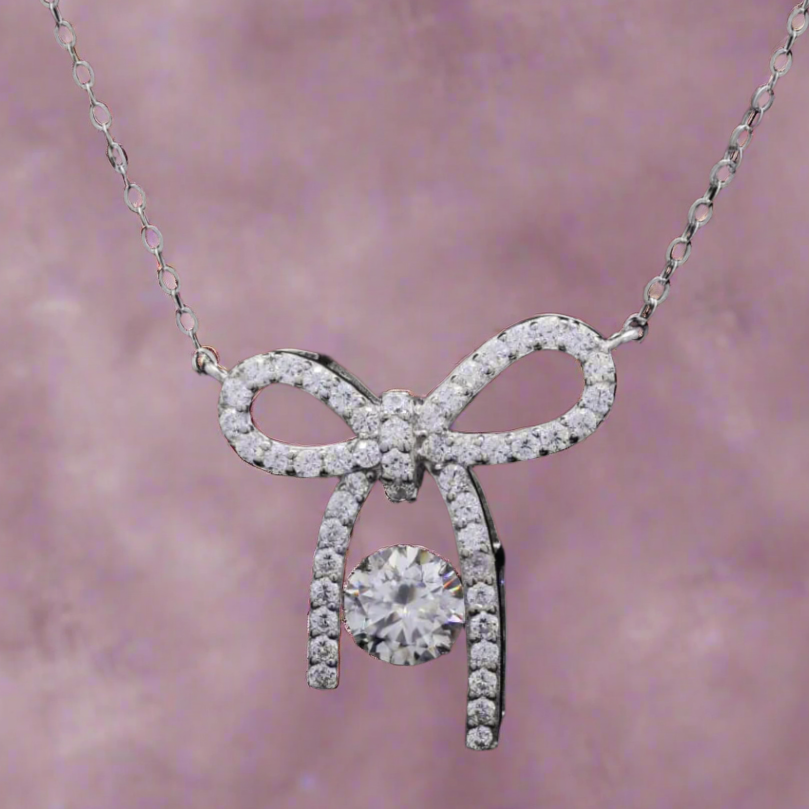 Sterling Silver Elegant Bow Pendant with Moissanite